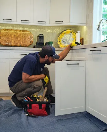 KCB Plumbing technician repairing kitchen plumbing