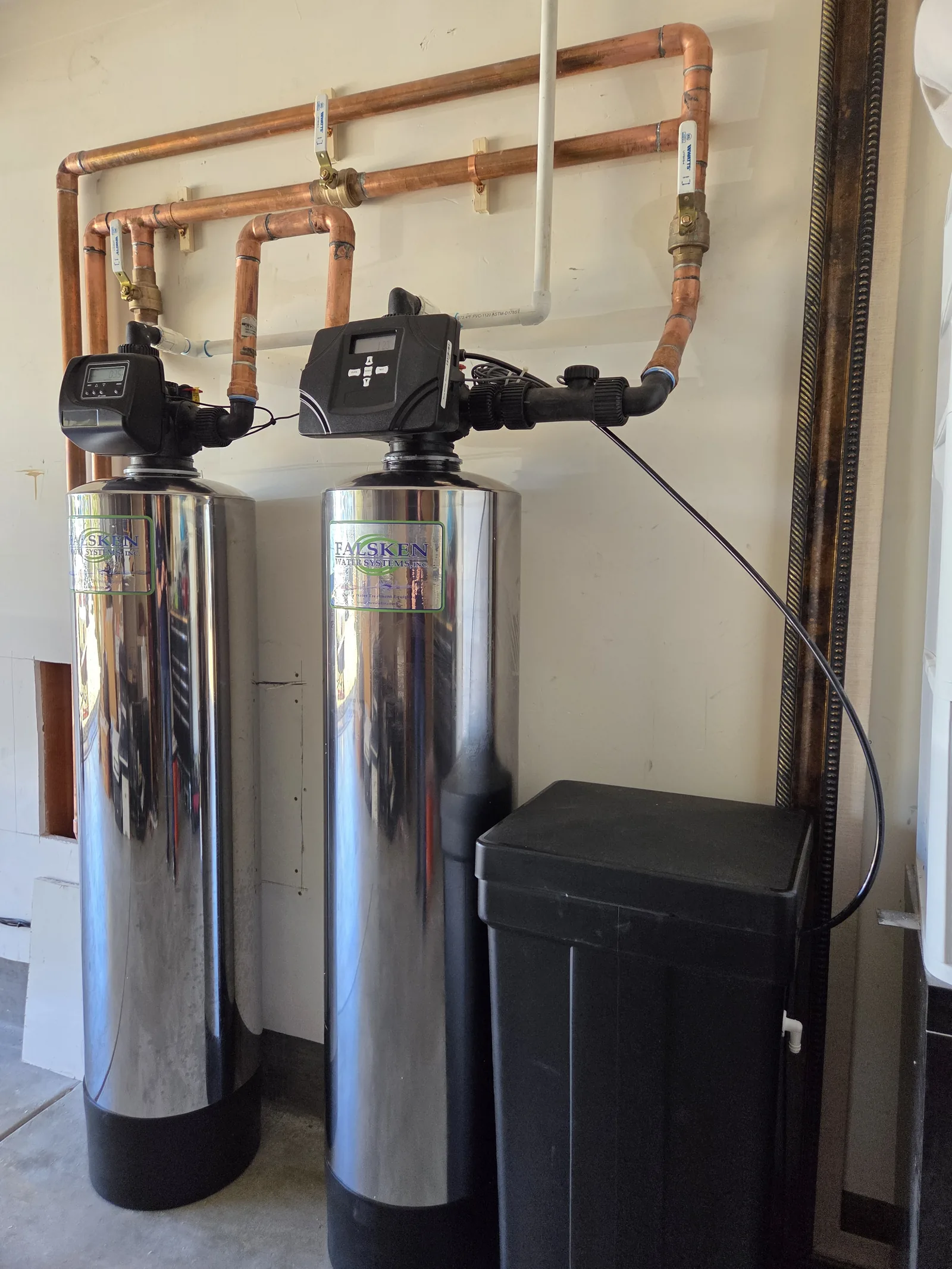 Completed twin-tank water treatment system with copper piping installed by KCB Plumbing in Laguna Beach